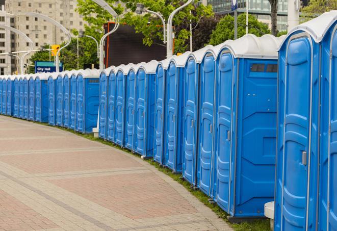 a line of portable restrooms at an outdoor wedding, catering to guests with style and comfort in Calumet City